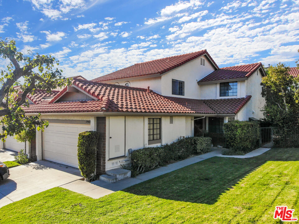 19401 Crystal Ridge Lane Porter Ranch, CA 91326 - Photo 1 of 45 front view of a house with a yard