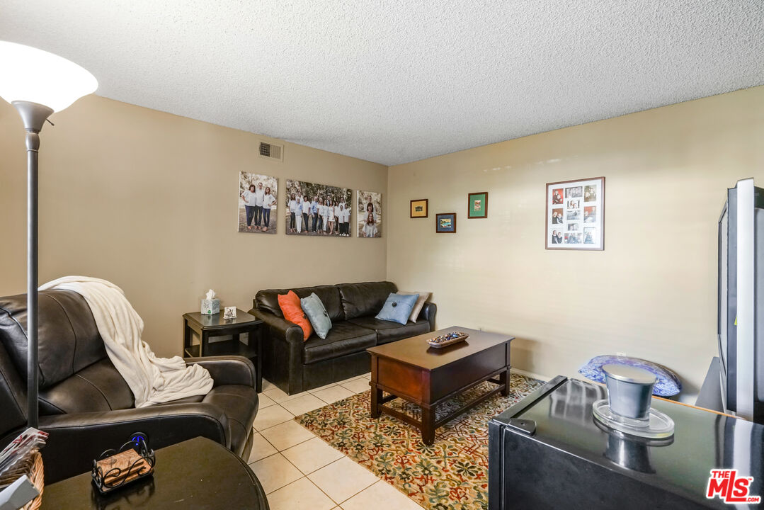 19401 Crystal Ridge Lane Porter Ranch, CA 91326 - Photo 13 of 45 a living room with furniture and a couch