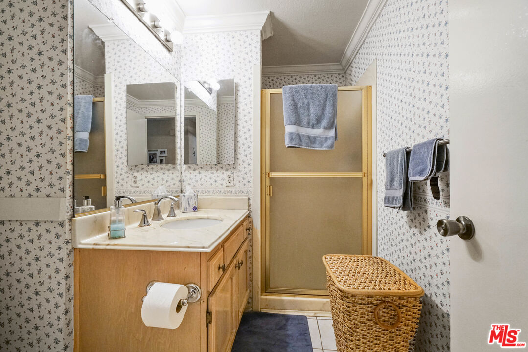 19401 Crystal Ridge Lane Porter Ranch, CA 91326 - Photo 15 of 45 a bathroom with a sink and mirror