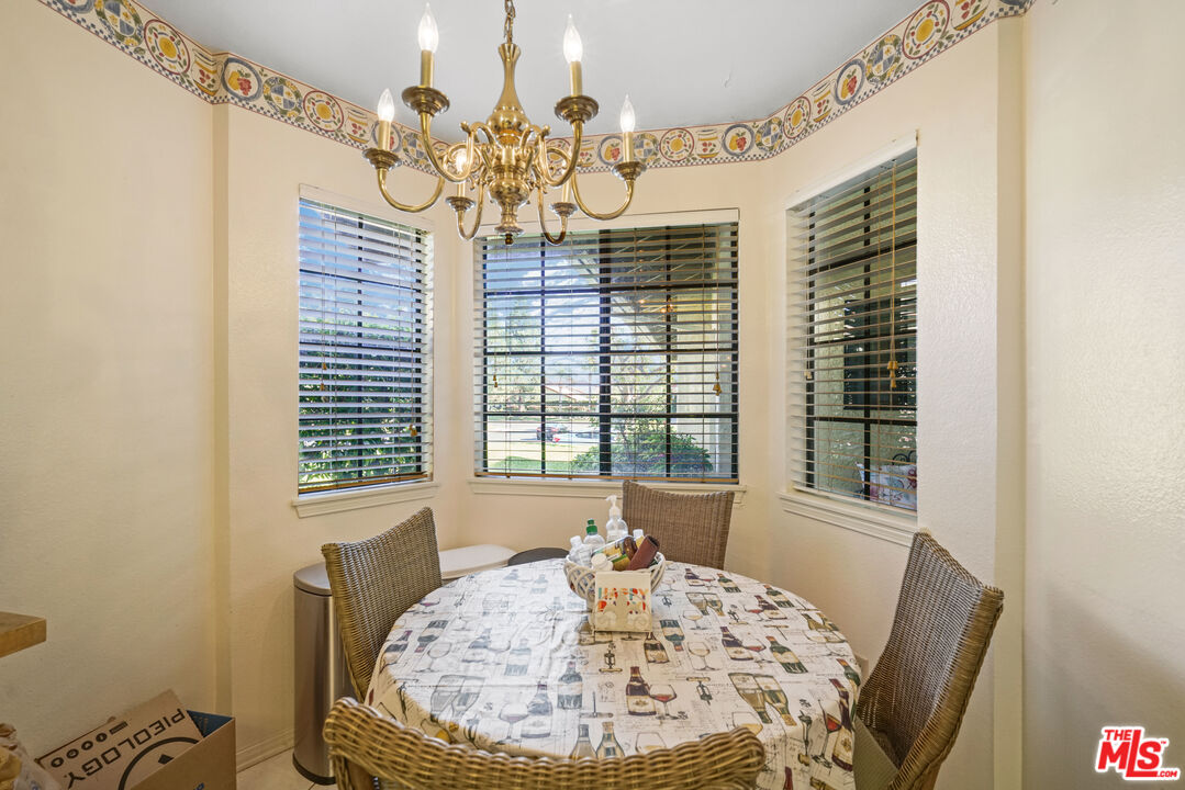 19401 Crystal Ridge Lane Porter Ranch, CA 91326 - Photo 18 of 45 a view of a dining room with furniture and window