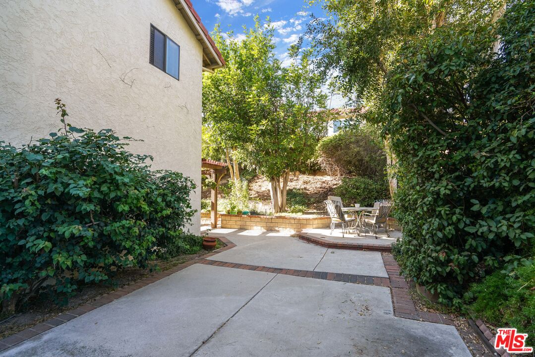 19401 Crystal Ridge Lane Porter Ranch, CA 91326 - Photo 22 of 45 a view of a yard with plants and trees