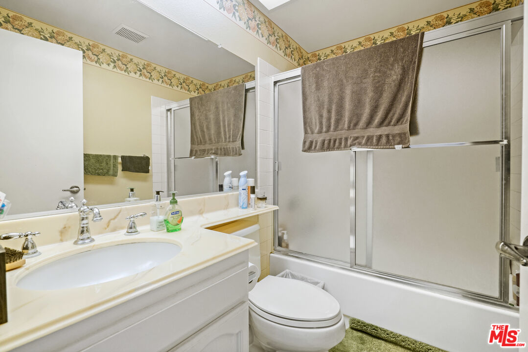 19401 Crystal Ridge Lane Porter Ranch, CA 91326 - Photo 28 of 45 a bathroom with a sink a toilet and shower