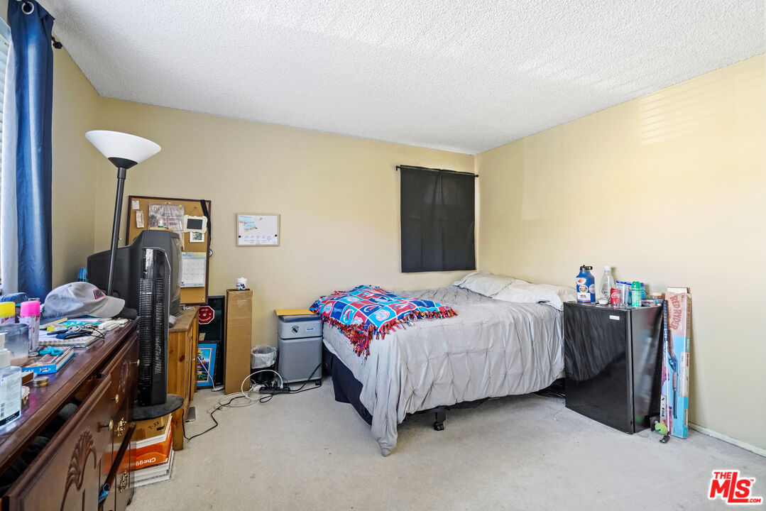 19401 Crystal Ridge Lane Porter Ranch, CA 91326 - Photo 29 of 45 a bedroom with a bed and a window