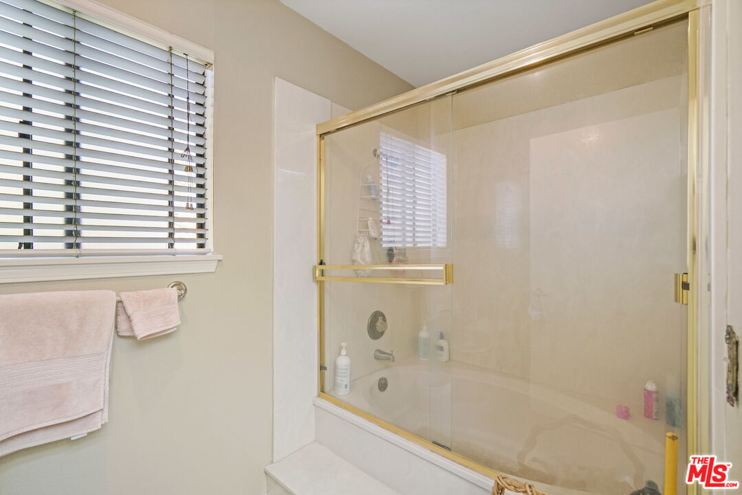 19401 Crystal Ridge Lane Porter Ranch, CA 91326 - Photo 37 of 45 a bathroom with a bathtub and a shower