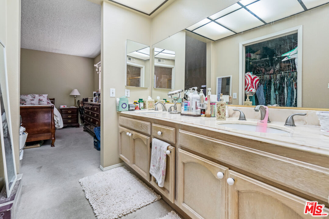 19401 Crystal Ridge Lane Porter Ranch, CA 91326 - Photo 38 of 45 a bathroom with a sink and a mirror