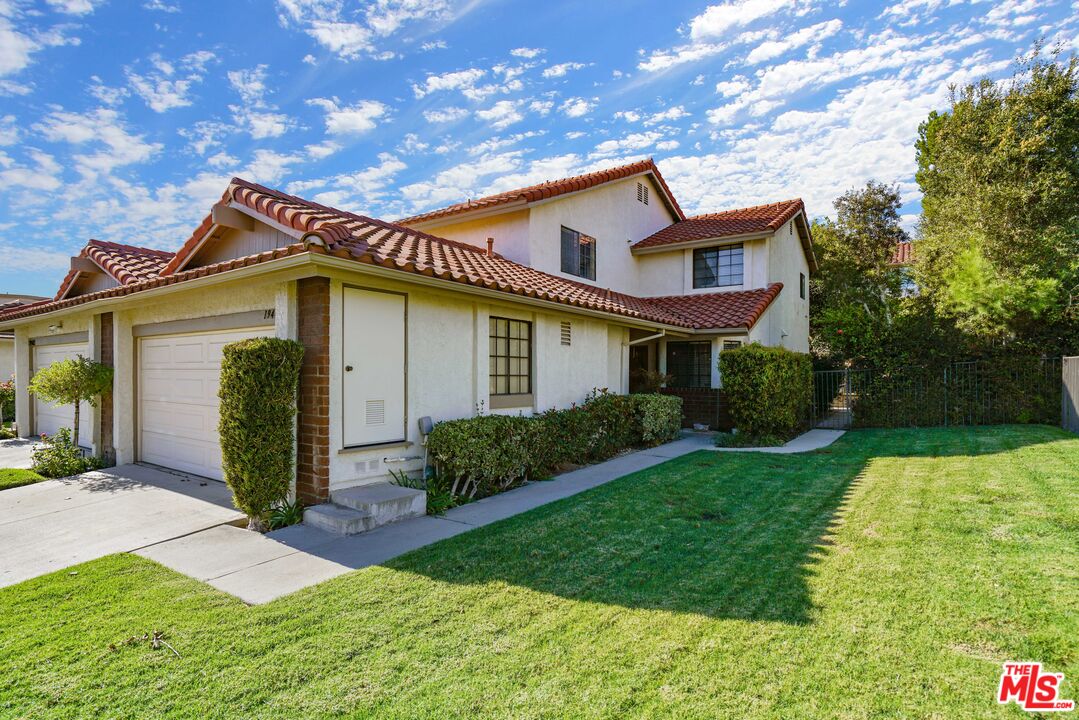 19401 Crystal Ridge Lane Porter Ranch, CA 91326 - Photo 41 of 45 a front view of a house with garden