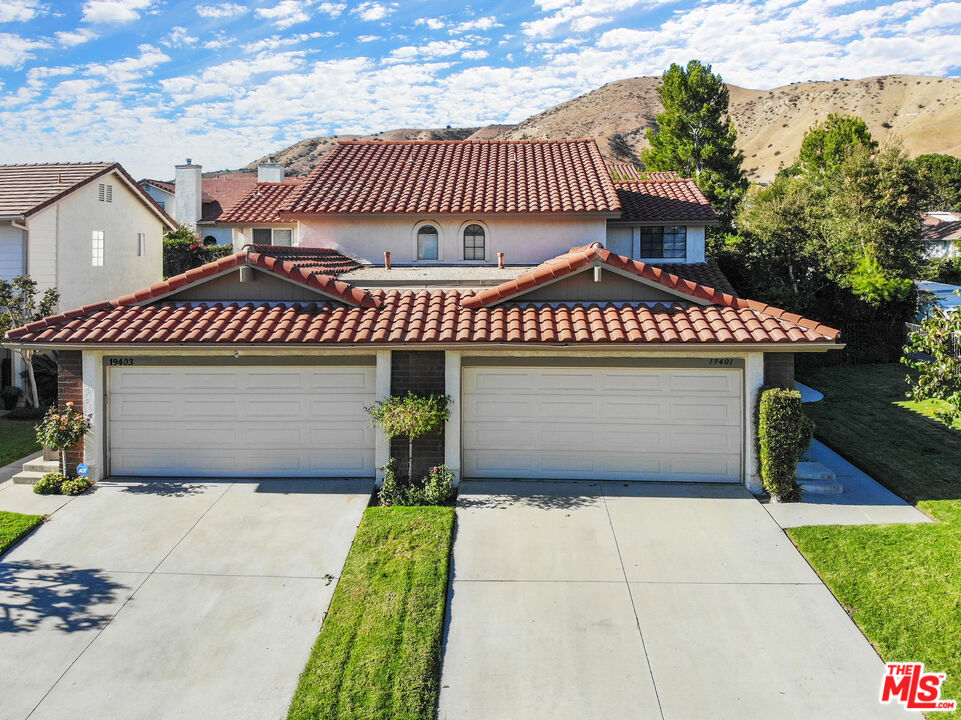 19401 Crystal Ridge Lane Porter Ranch, CA 91326 - Photo 7 of 45 a front view of a house with garden