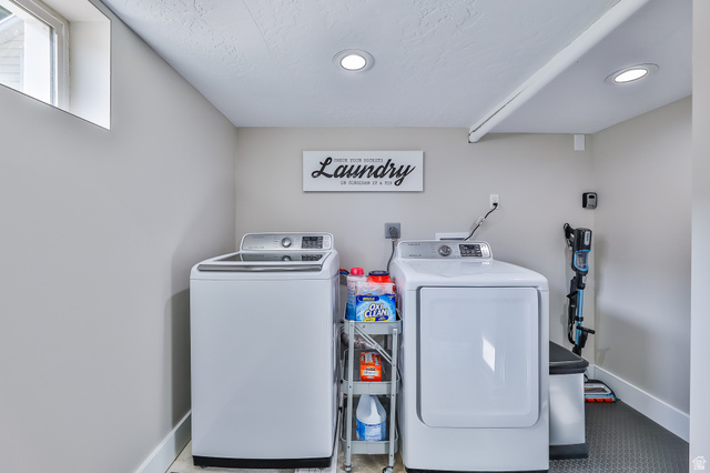 59 East 8680th Street South Sandy, UT 84070 - Photo 22 of 33 Dedicated laundry area featuring a window, recessed lighting, and durable flooring