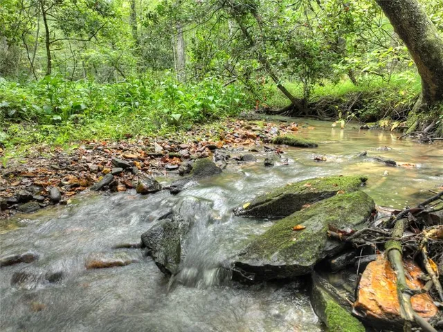 a view of swimming pool with a yard