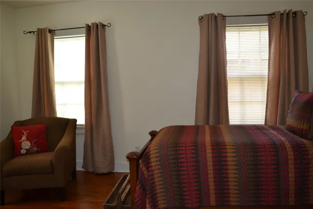 a view of a livingroom with furniture and a window