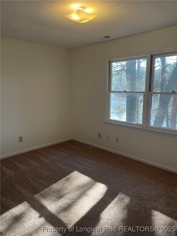 609 Georgetown Circle Fayetteville, NC 28314 - Photo 29 of 36 an empty room with wooden floor and windows