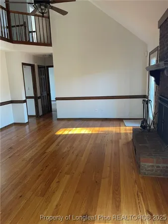 a view of a living room with wooden floor