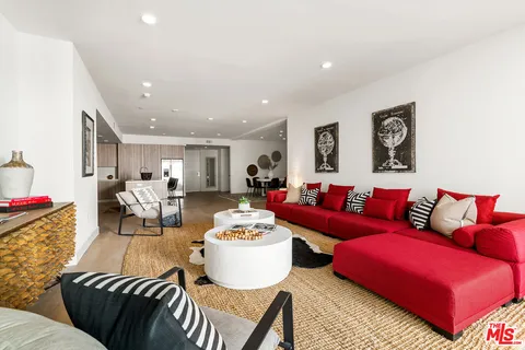 a living room with furniture and a table