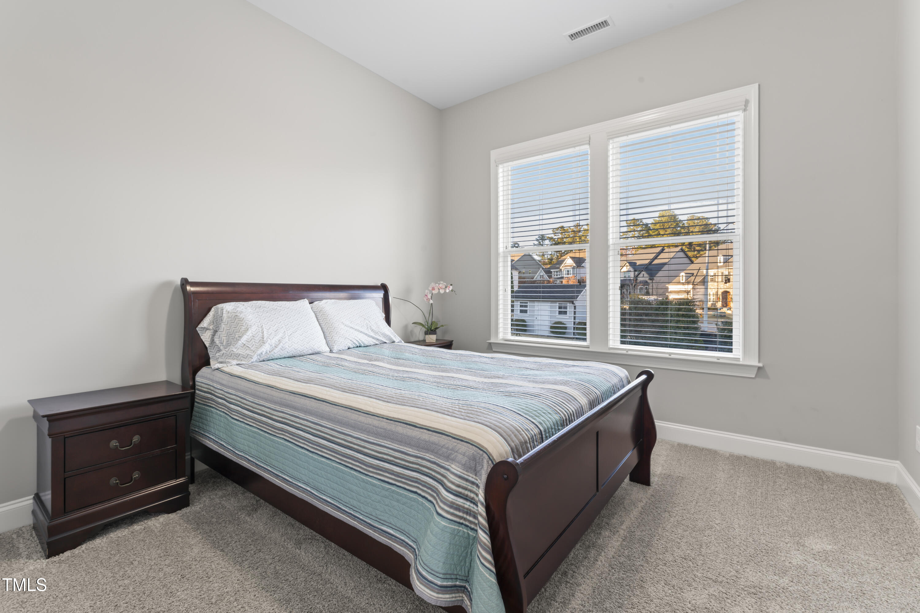 5244 Aleppo Lane Raleigh, NC 27613 - Photo 15 of 41 Private 1st Floor Bedroom tucked away with a full bathroom.