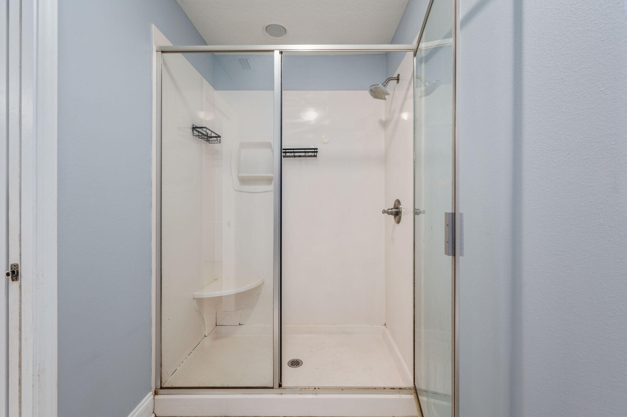 2909 Chancery Lane Crestview, FL 32539 - Photo 18 of 34 a bathroom with a glass shower door