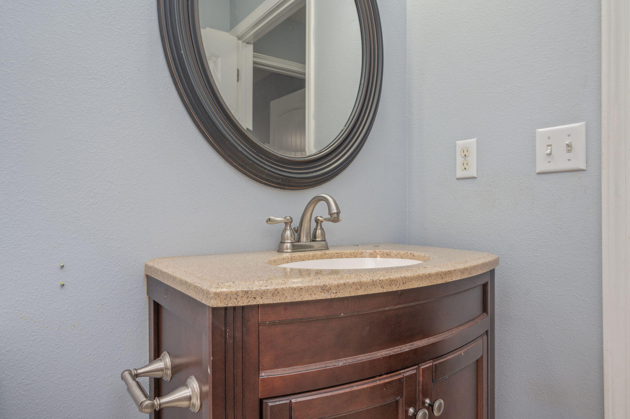 2909 Chancery Lane Crestview, FL 32539 - Photo 29 of 34 a close view of a sink and a mirror