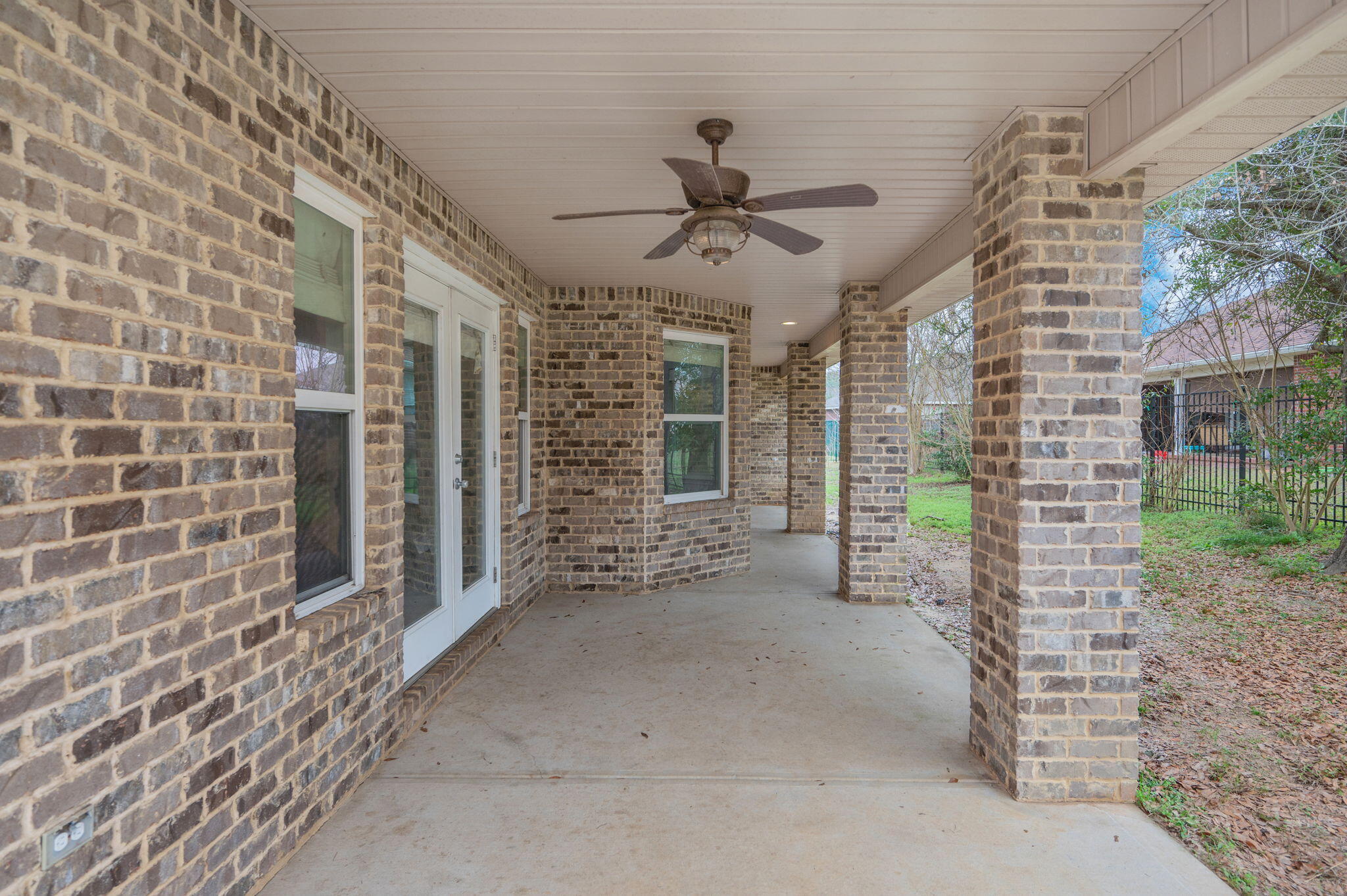 2909 Chancery Lane Crestview, FL 32539 - Photo 31 of 34 a view of a porch with a table and chairs