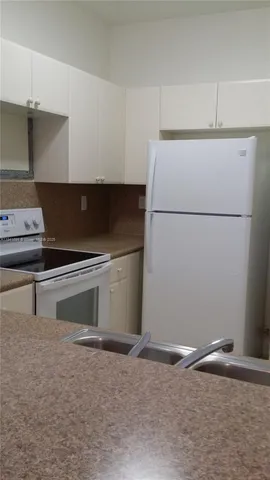 a utility room with washer and dryer