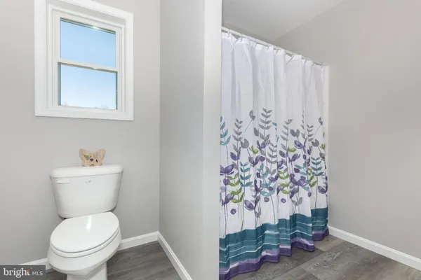 a bathroom with a toilet and a sink