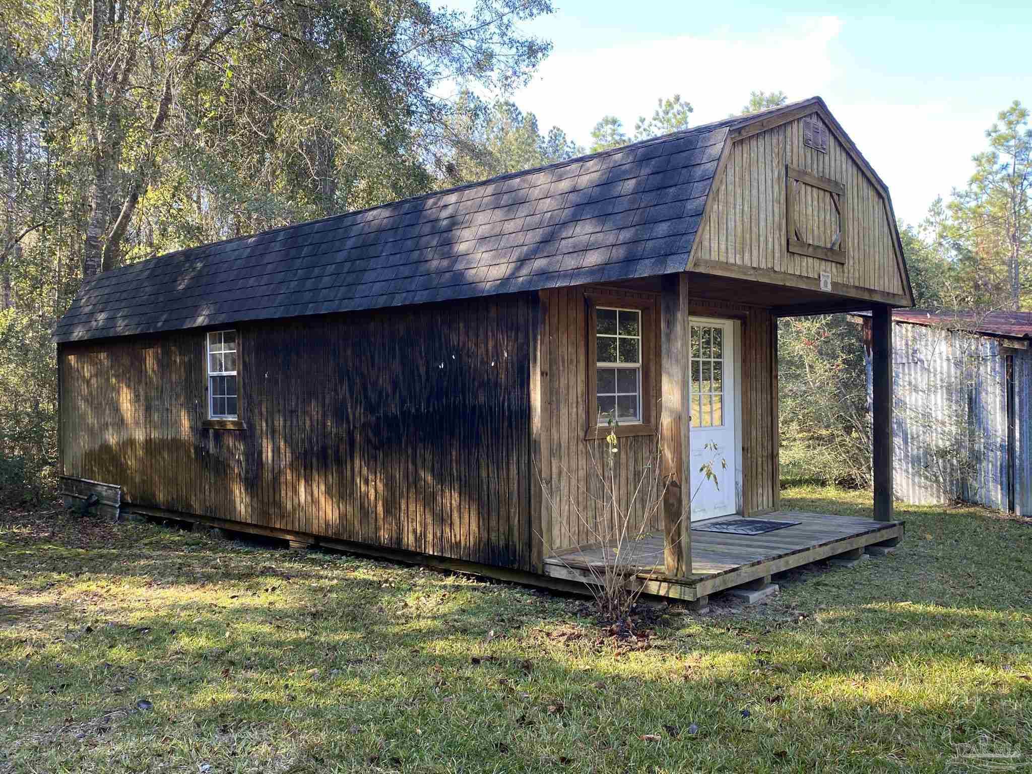 9141 Frank Pitman Road Milton, FL 32570 - Photo 11 of 51 a front view of house with yard