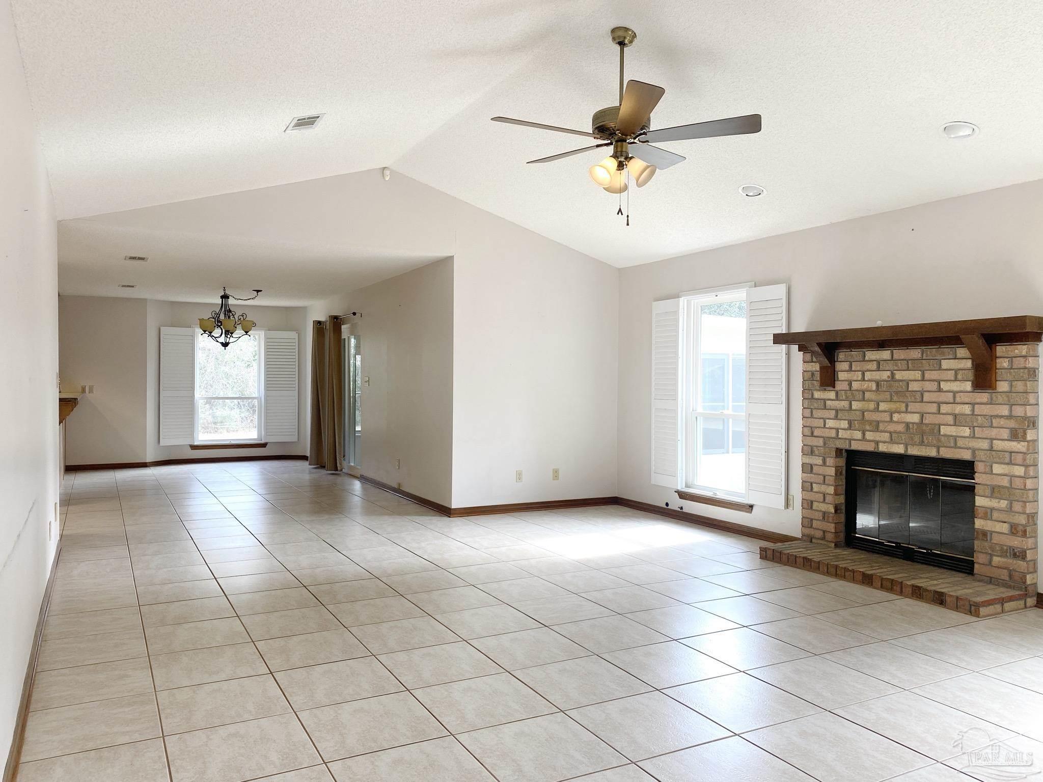 9141 Frank Pitman Road Milton, FL 32570 - Photo 14 of 51 a view of an empty room with a fireplace