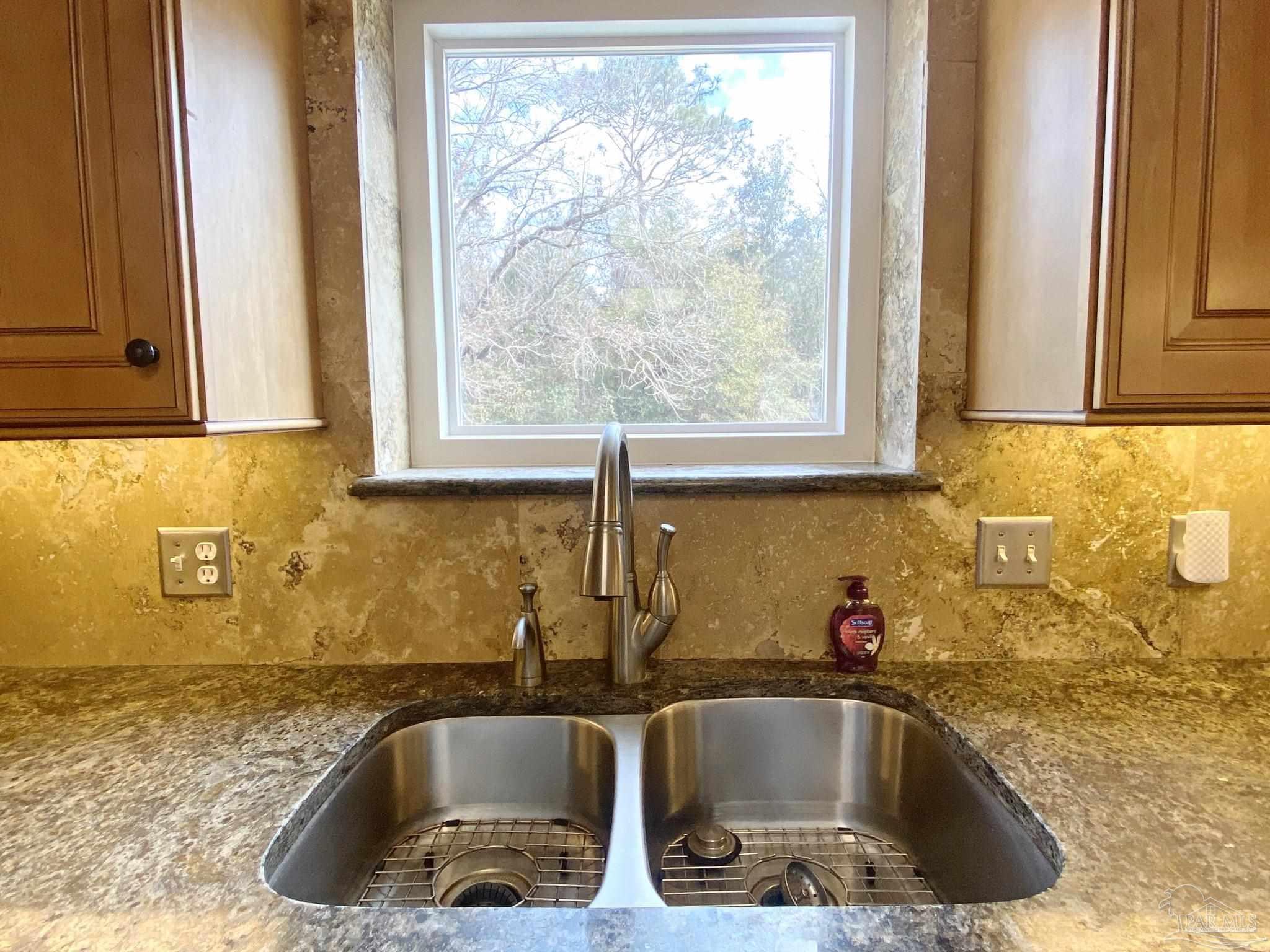 9141 Frank Pitman Road Milton, FL 32570 - Photo 20 of 51 a kitchen with a sink and large window