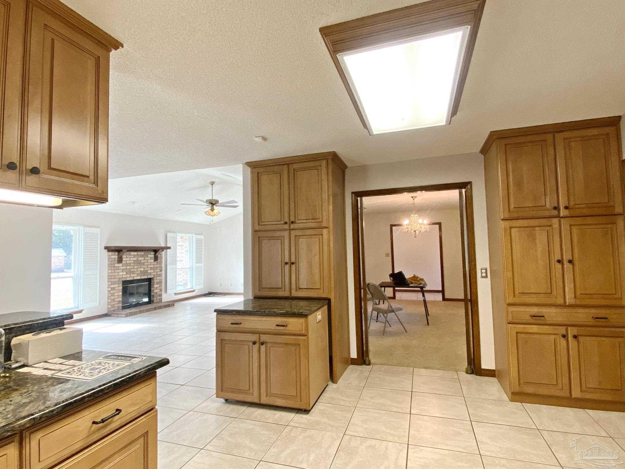 9141 Frank Pitman Road Milton, FL 32570 - Photo 22 of 51 a kitchen with stainless steel appliances granite countertop a stove and a refrigerator with granite countertops