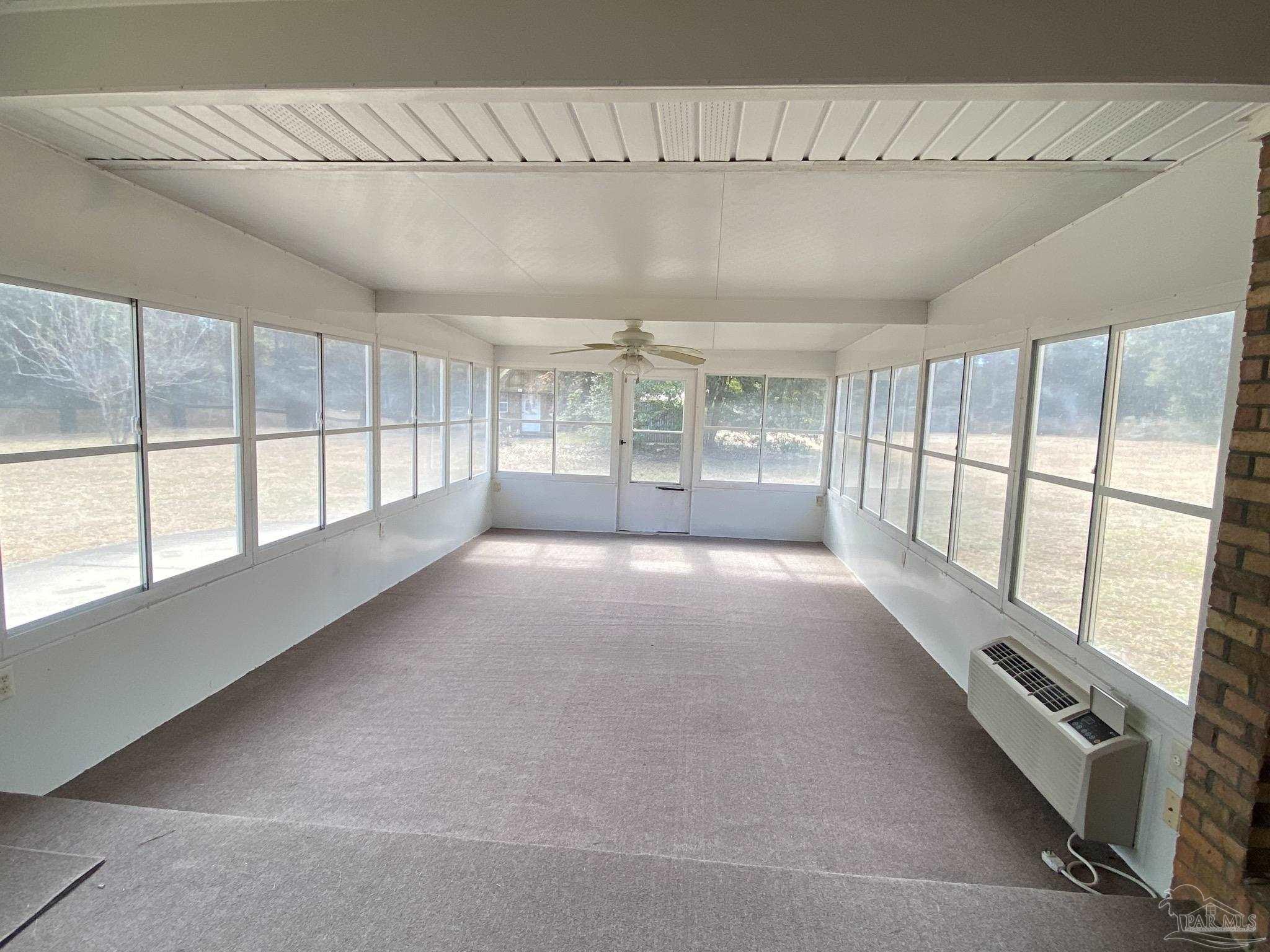 9141 Frank Pitman Road Milton, FL 32570 - Photo 30 of 51 a view of an empty room with a window