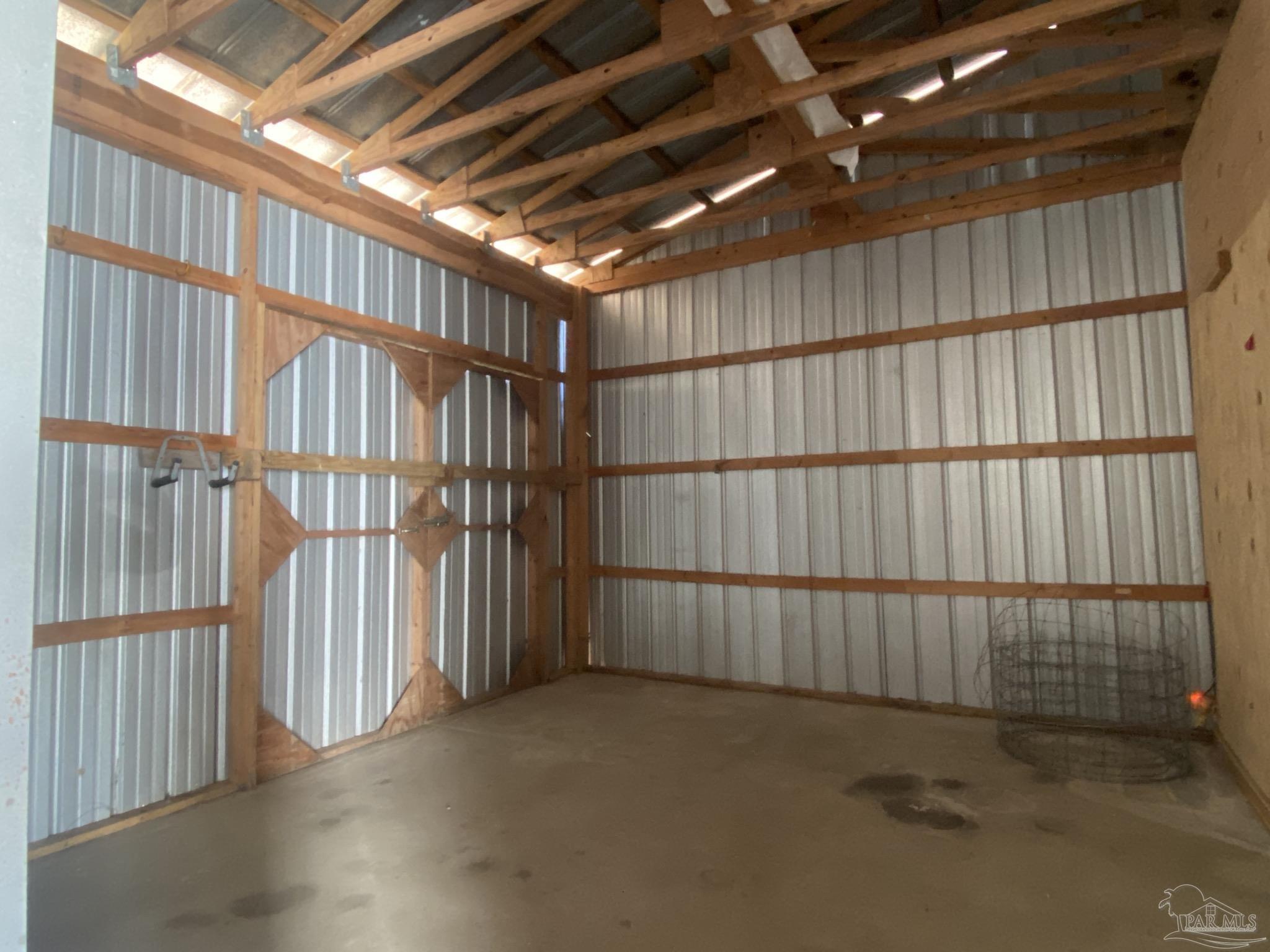 9141 Frank Pitman Road Milton, FL 32570 - Photo 41 of 51 a view of an empty room with wooden walls