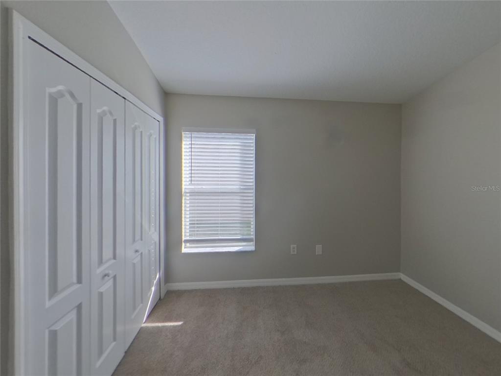 Undisclosed Address Ruskin, FL 33570 - Photo 12 of 16 an empty room with windows