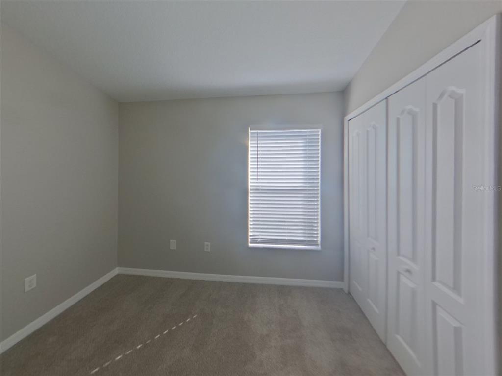 Undisclosed Address Ruskin, FL 33570 - Photo 13 of 16 an empty room with a window