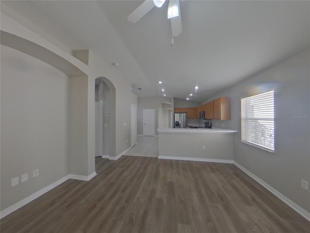Undisclosed Address Ruskin, FL 33570 - Photo 2 of 16 a view of a kitchen with wooden floor and a window