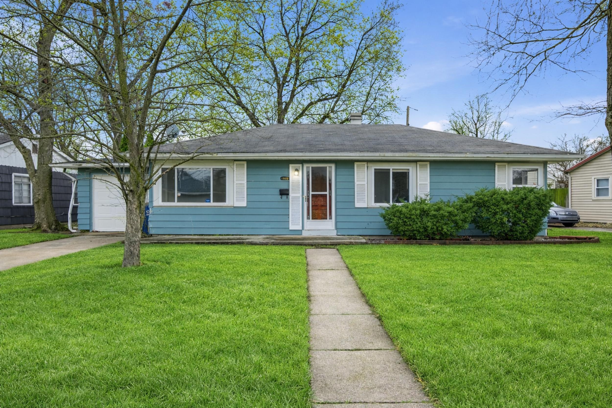 1620 180th Place Hammond, IN 46324 - Photo 1 of 19 a front view of a house with a yard