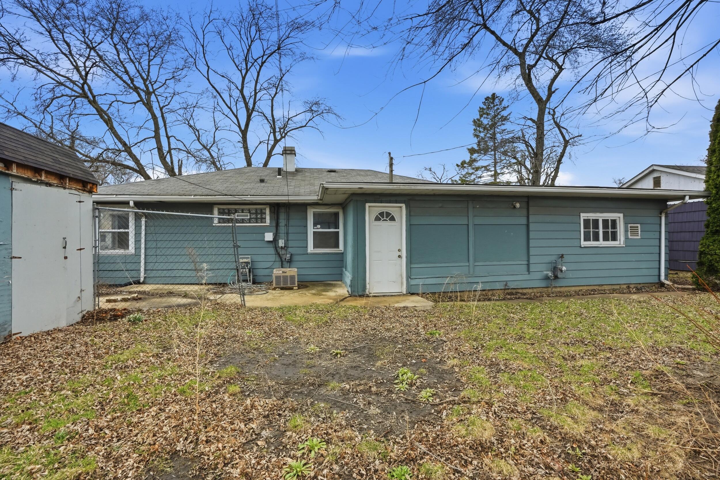 1620 180th Place Hammond, IN 46324 - Photo 17 of 19 a house with trees in the background