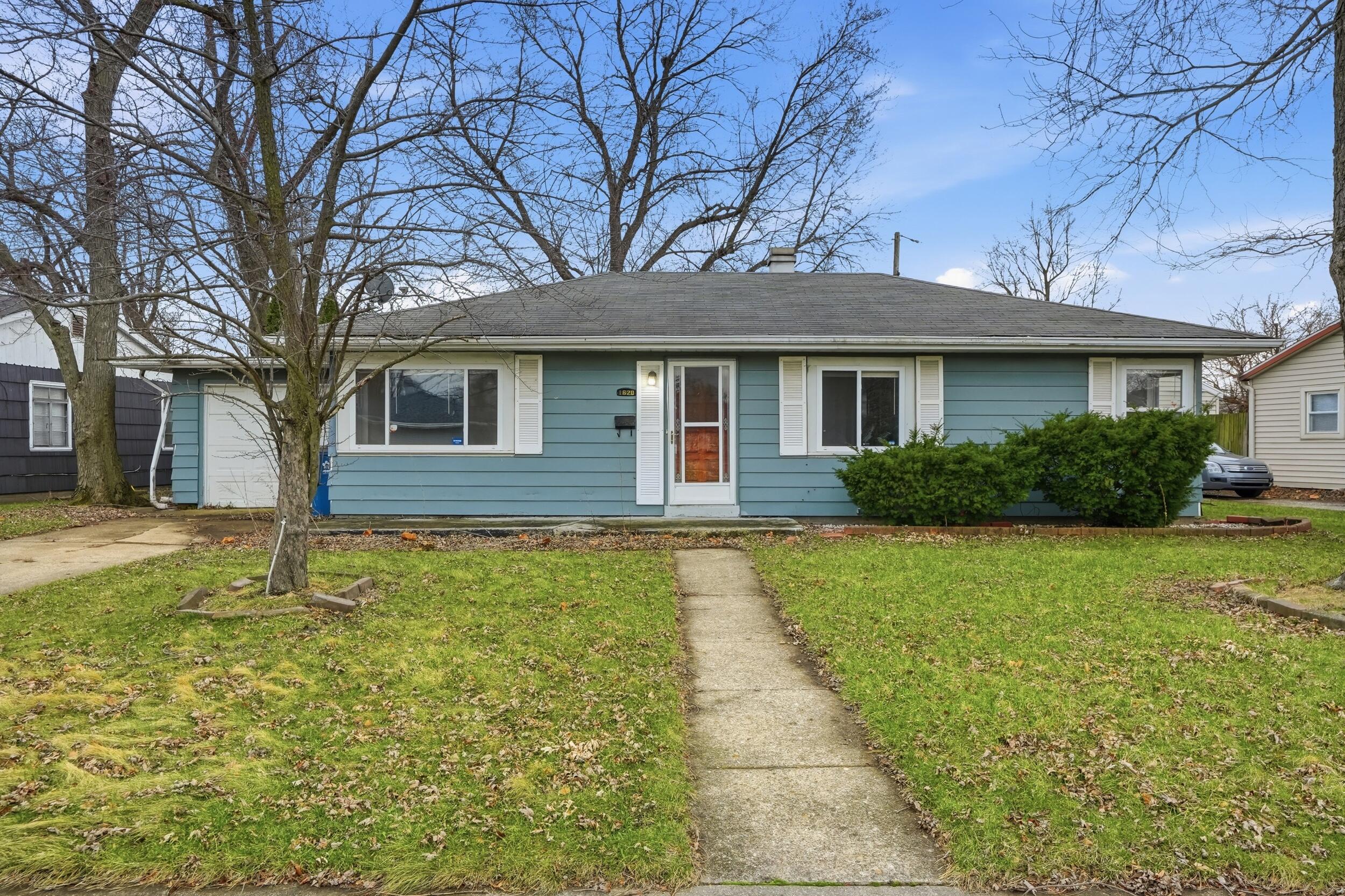 1620 180th Place Hammond, IN 46324 - Photo 2 of 19 a front view of a house with garden