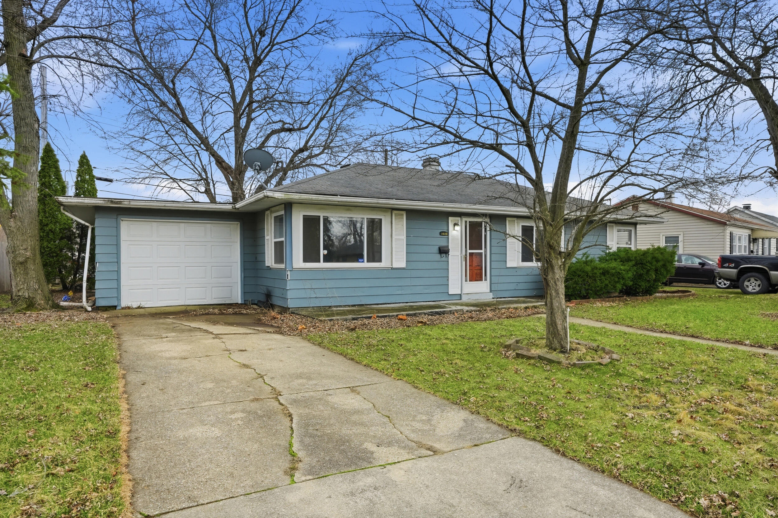 1620 180th Place Hammond, IN 46324 - Photo 3 of 19 a house with trees in the background