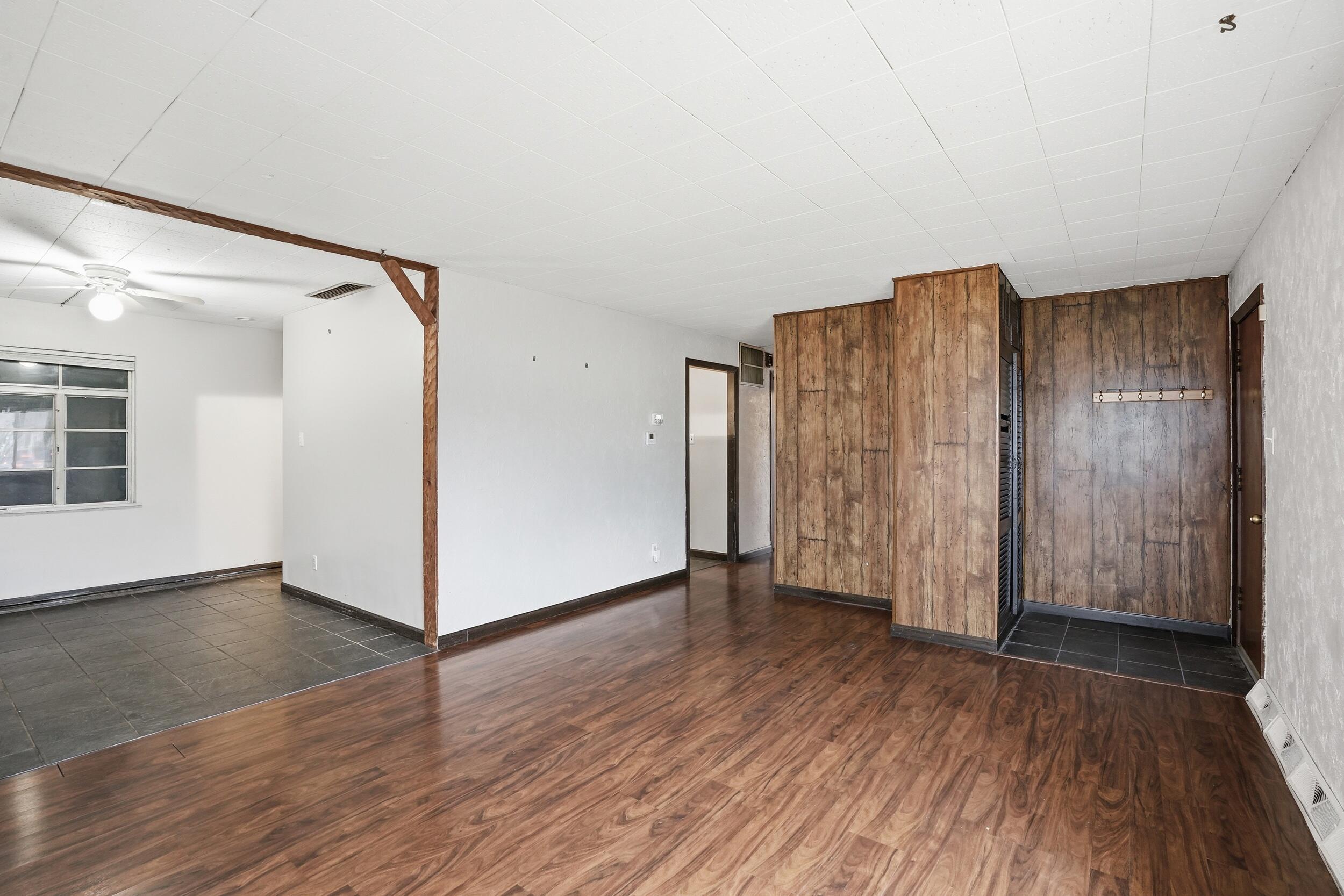 1620 180th Place Hammond, IN 46324 - Photo 7 of 19 an empty room with wooden floor door and windows