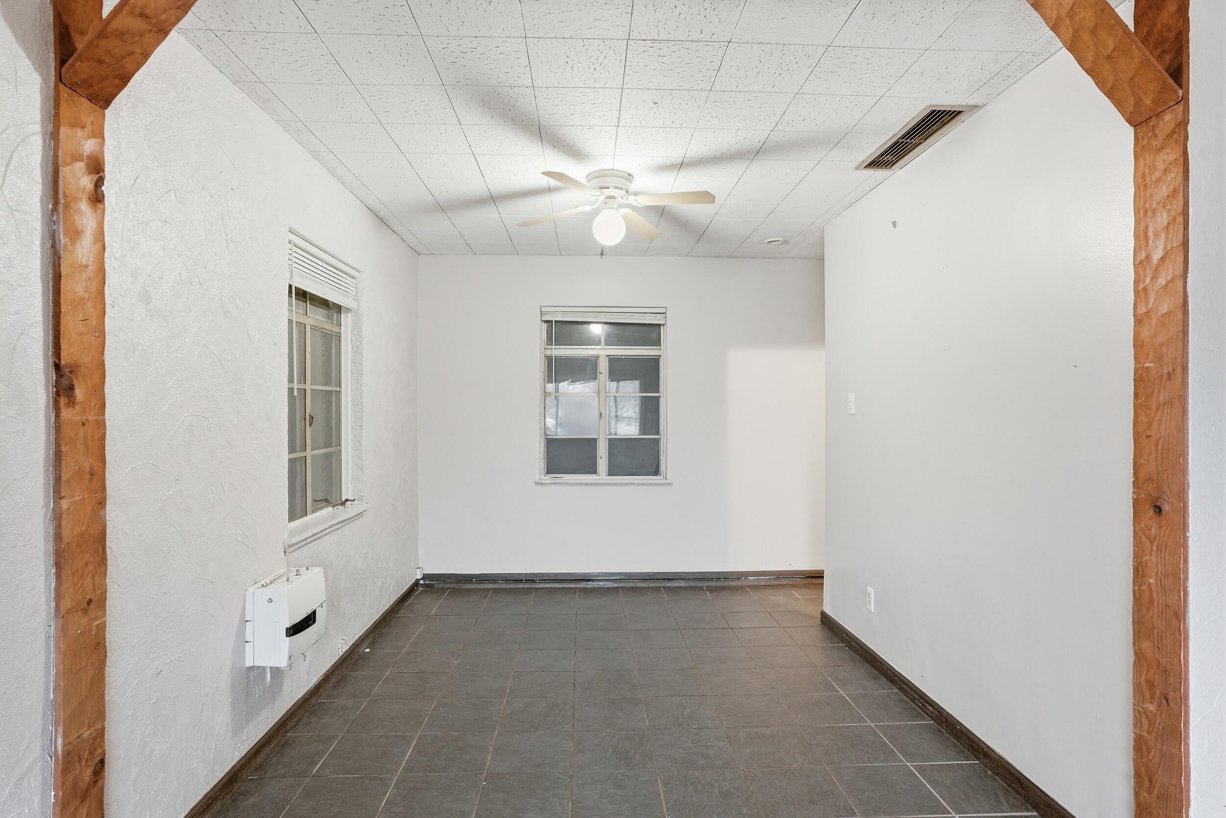 1620 180th Place Hammond, IN 46324 - Photo 9 of 19 an empty room with windows and fan