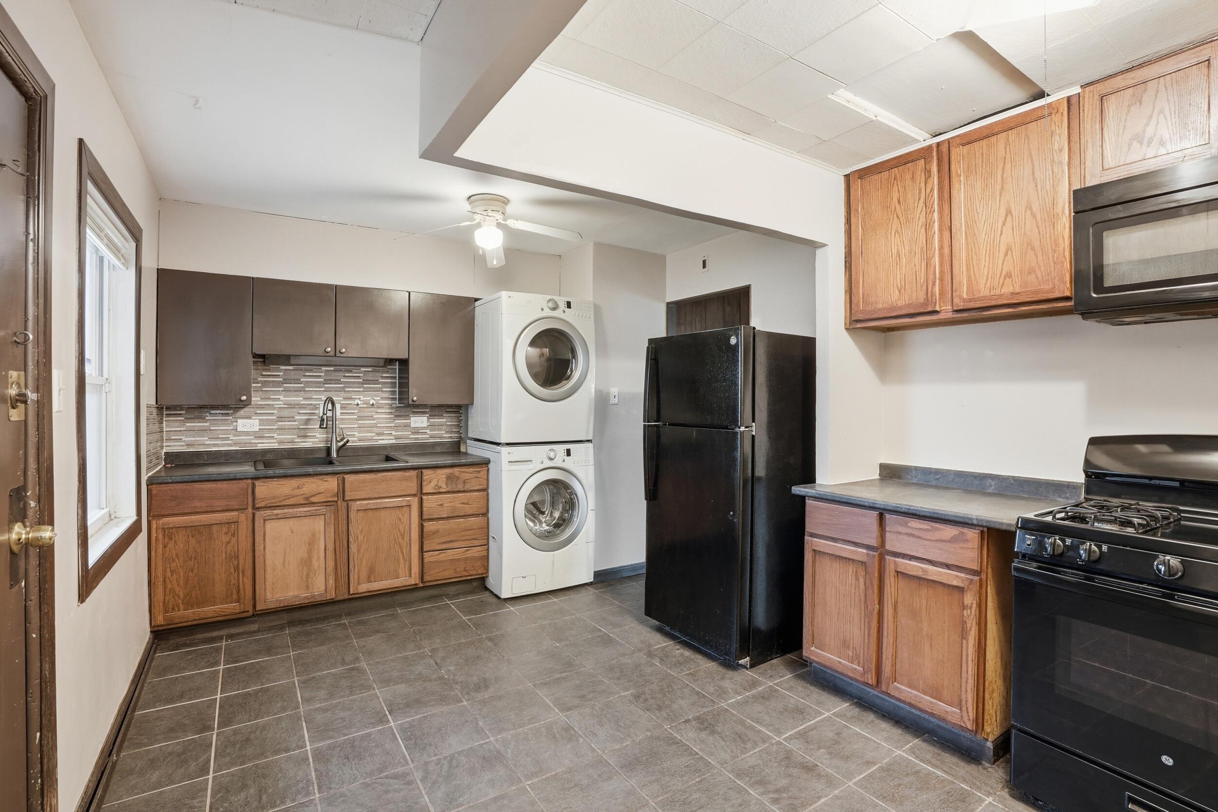 1620 180th Place Hammond, IN 46324 - Photo 10 of 19 a kitchen with stainless steel appliances granite countertop a refrigerator a stove top oven a sink and dishwasher