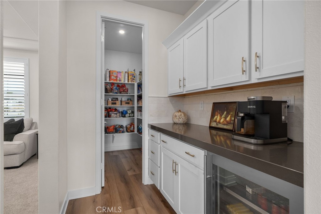 16155 New Canaan Court Riverside, CA 92504 - Photo 10 of 26 a kitchen with stainless steel appliances granite countertop a refrigerator and cabinets