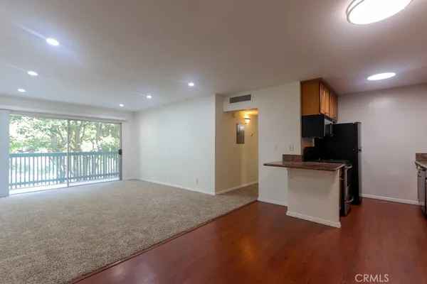 a view of livingroom with furniture wooden floor and window