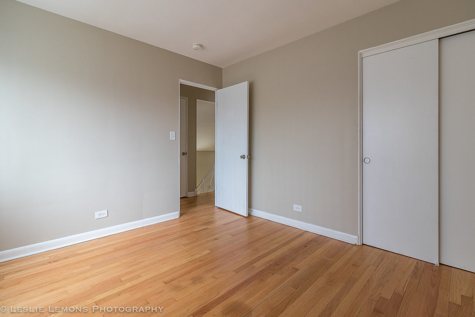 8541 North Shermer Road Niles, IL 60714 - Photo 18 of 26 a view of an empty room with wooden floor