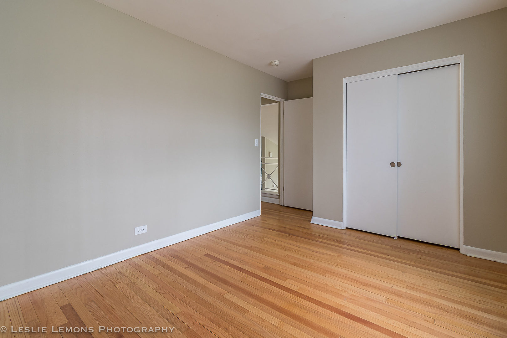 8541 North Shermer Road Niles, IL 60714 - Photo 20 of 26 a view of an empty room with wooden floor