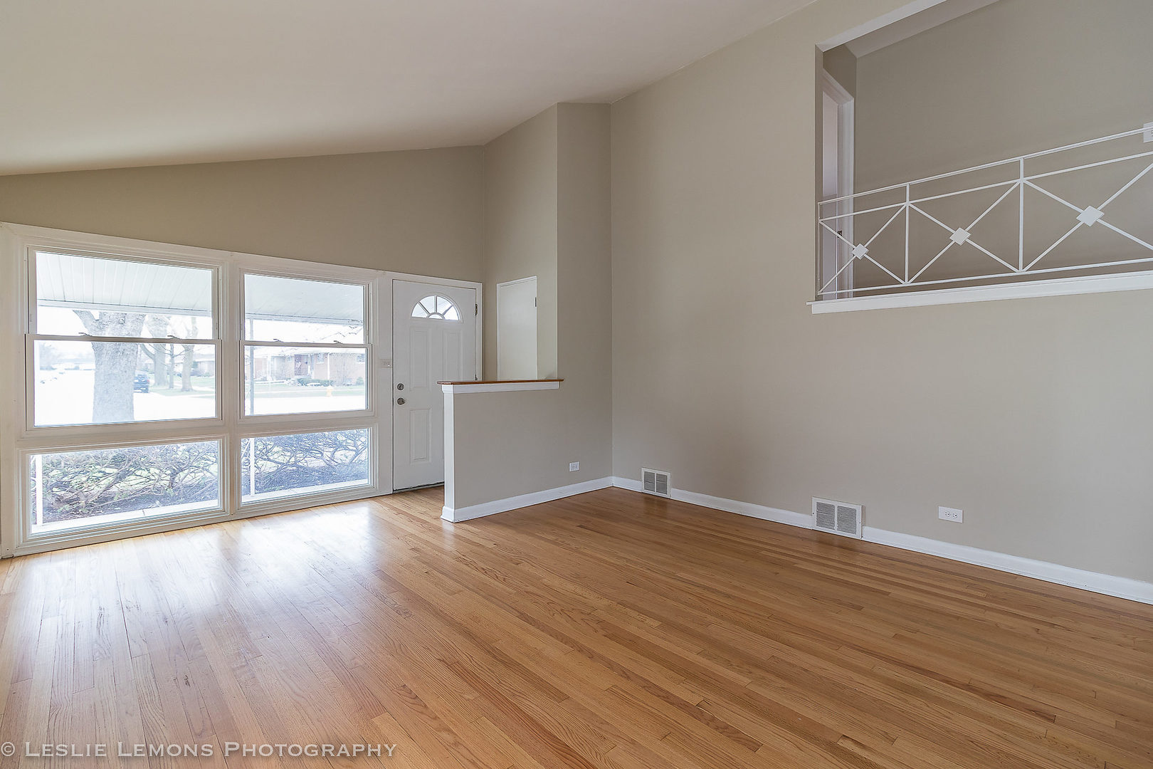 8541 North Shermer Road Niles, IL 60714 - Photo 3 of 26 wooden floor in an empty room with a window