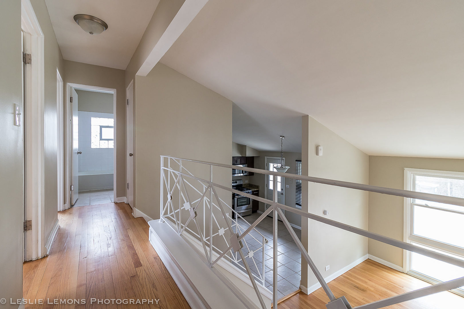 8541 North Shermer Road Niles, IL 60714 - Photo 22 of 26 a view of a hallway with wooden floor and furniture