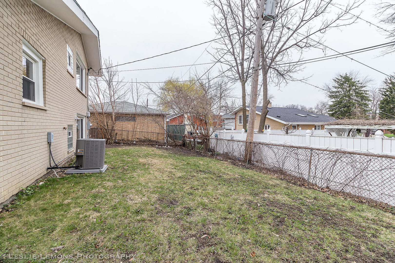 8541 North Shermer Road Niles, IL 60714 - Photo 24 of 26 a view of a backyard with wooden fence