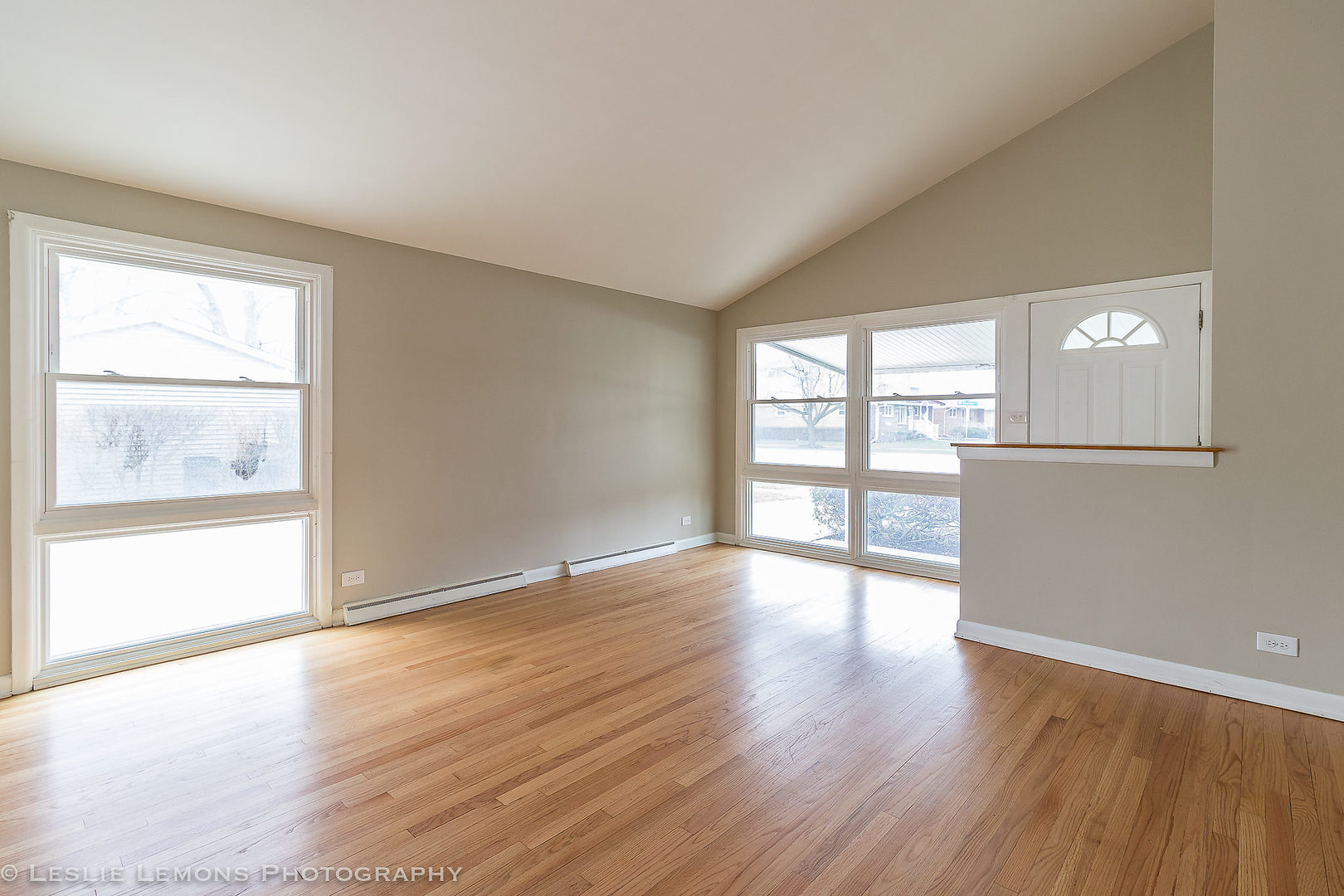 8541 North Shermer Road Niles, IL 60714 - Photo 5 of 26 an empty room with wooden floor and windows