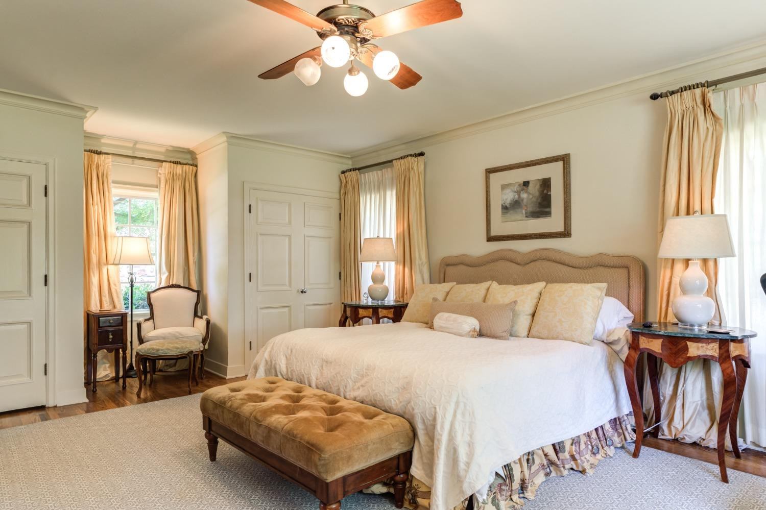 4909 19th Street Lubbock, TX 79407 - Photo 14 of 50 a bedroom with a bed and a chandelier