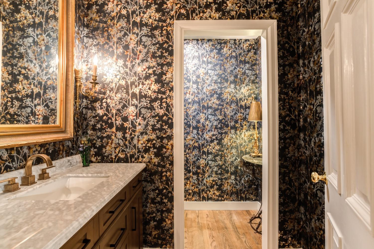 4909 19th Street Lubbock, TX 79407 - Photo 17 of 50 a bathroom with a granite countertop sink and a mirror