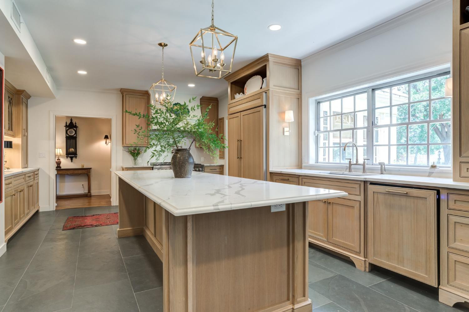 4909 19th Street Lubbock, TX 79407 - Photo 18 of 50 a kitchen with stainless steel appliances granite countertop a sink and dishwasher